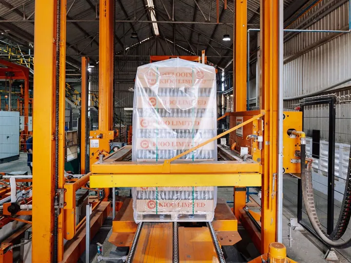 Automated packaging equipment inside a glass factory